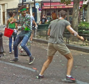 Other color-coordinated teams in white, black and green entered the square. Good-natured taunts ensued, and skirmishes with buckets of water.