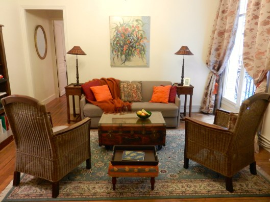 The apartment today, with the same coffee table