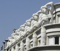 Replicas of Michelangelo’s Dying Slave pose on top of police headquarters.
